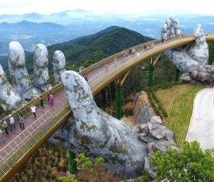 The hands supporting the gold bridge, to keep the sky in Da Nang – Vietnam