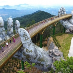 The hands supporting the gold bridge, to keep the sky in Da Nang – Vietnam